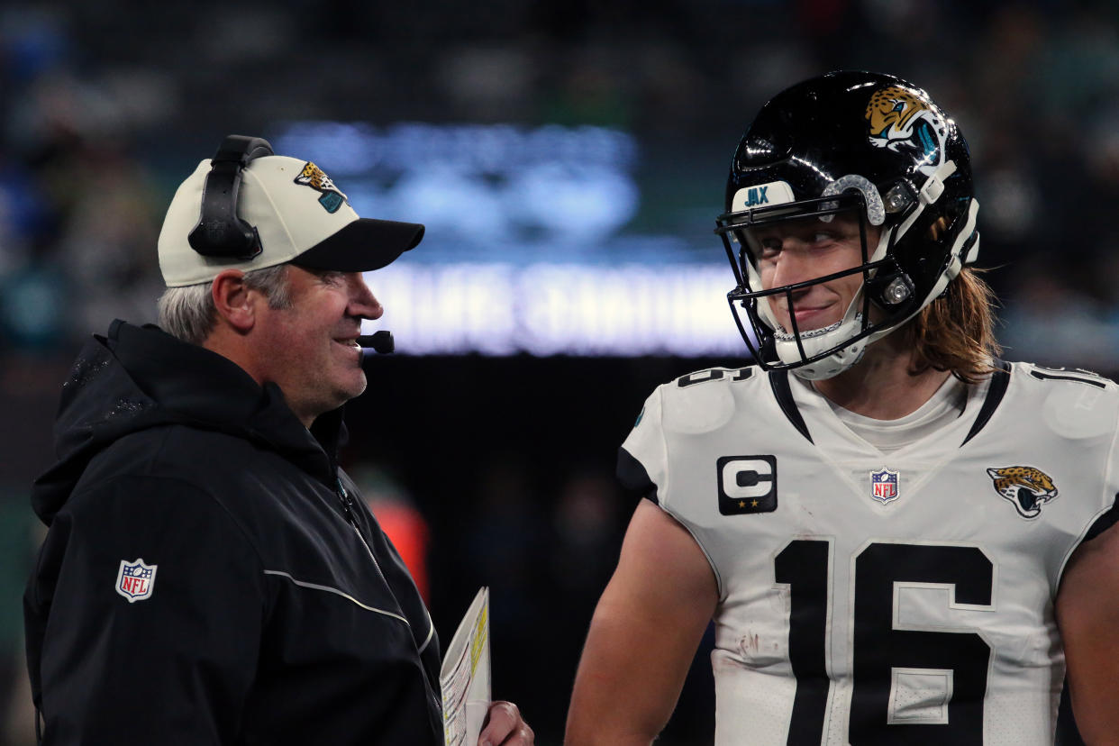 EAST RUTHERFORD, NEW JERSEY - DECEMBER 22: Head Coach Doug Pederson discusses a play with Quarterback Trevor Lawrence #16 of the Jacksonville Jaguars in the Thursday Night Football game in the rain between the Jacksonville Jaguars vs the New York Jets at MetLife Stadium on December 22, 2022 in East Rutherford, New Jersey.  (Photo by Al Pereira/Getty Images)