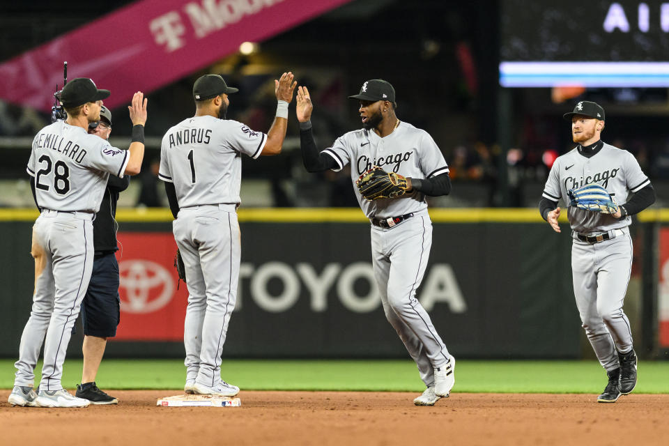 The Chicago White Sox players, from left to right, Zach Remillard, Elvis Andrus, Luis Robert Jr. and Clint Frazier celebrate after a victory over the Seattle Mariners in extra innings of a baseball game, Saturday, June 17, 2023, in Seattle. (AP Photo/Caean Couto)