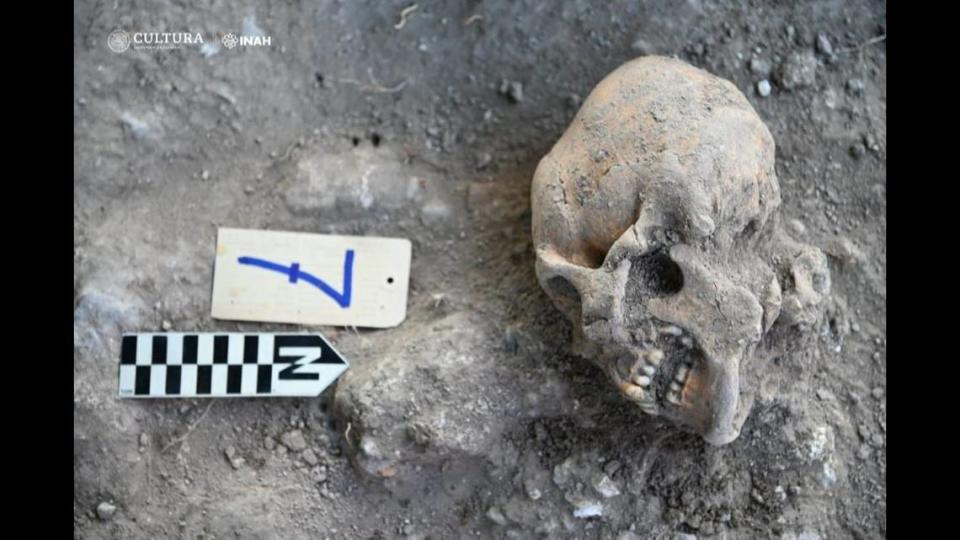 Two of the unearthed skulls had jade inlays in their teeth, archaeologists said.