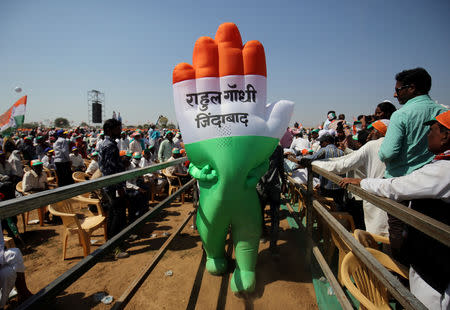 FILE PHOTO: A supporter wearing an inflatable symbol of India's main opposition Congress party walks during a public meeting in Gandhinagar, Gujarat, India, March 12, 2019. The words read: "Long live Rahul Gandhi". REUTERS/Amit DaveFile Photo