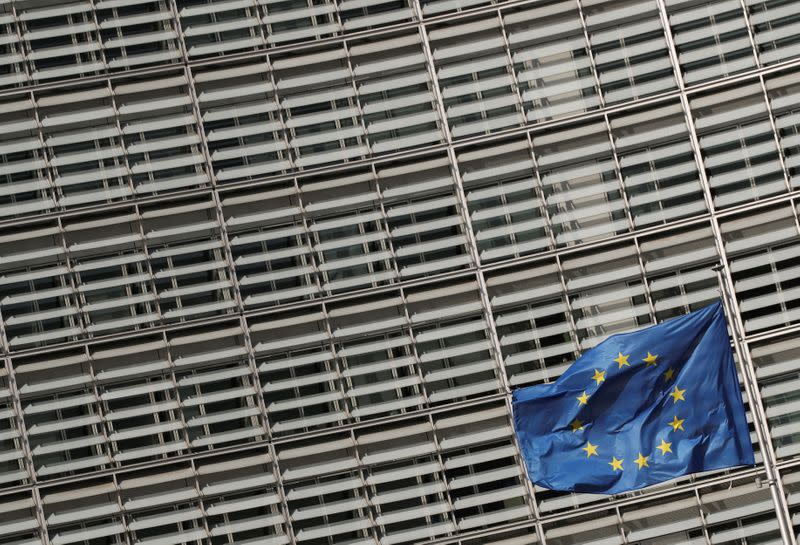 FILE PHOTO: European Union flags flutter outside the European Commission headquarters in Brussels