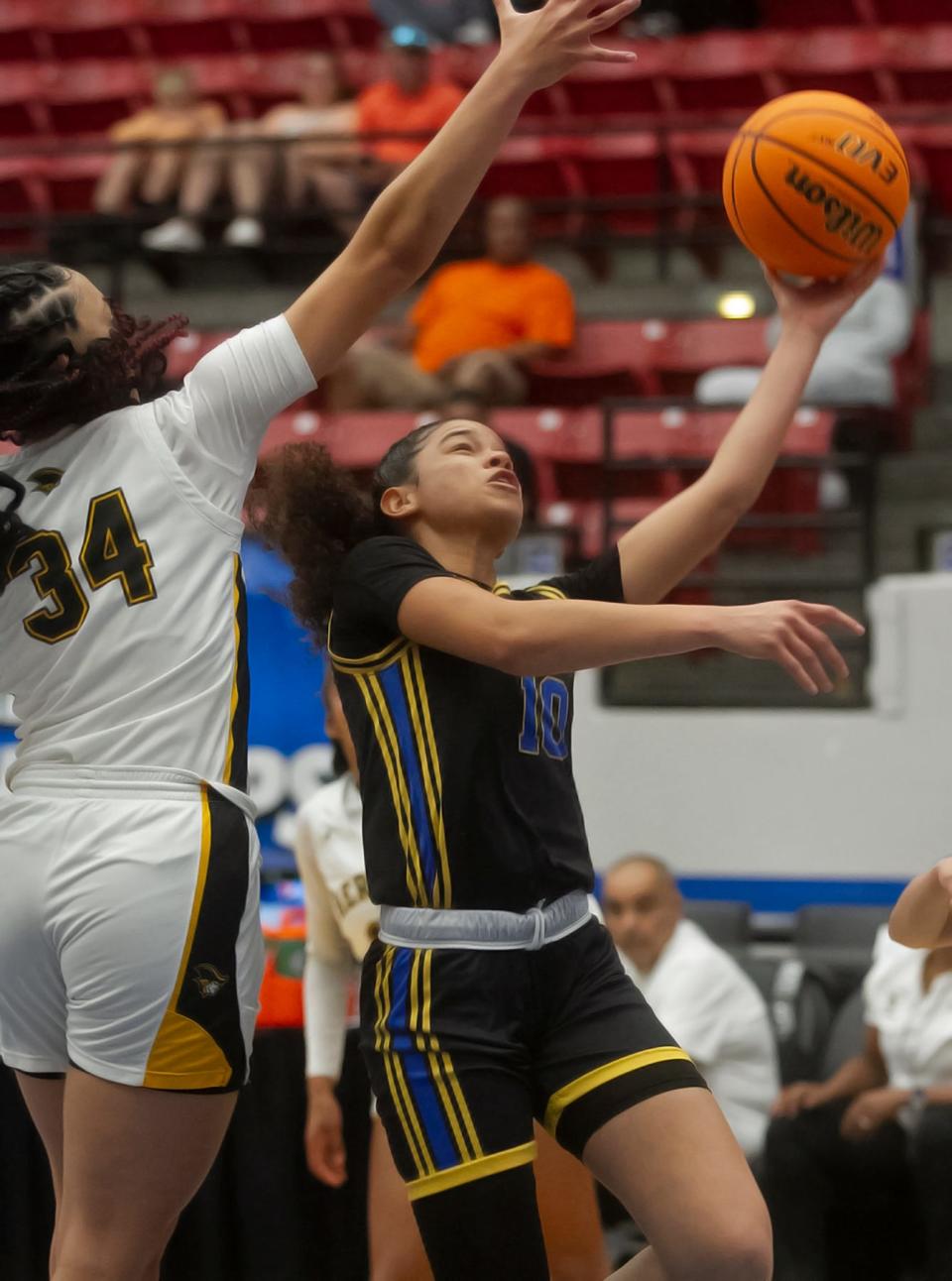 Mainland's Tia Dobson (10) goes up for a basket against American Heritage in the 5A state title game, Saturday, Feb. 25, 2023 in Lakeland.