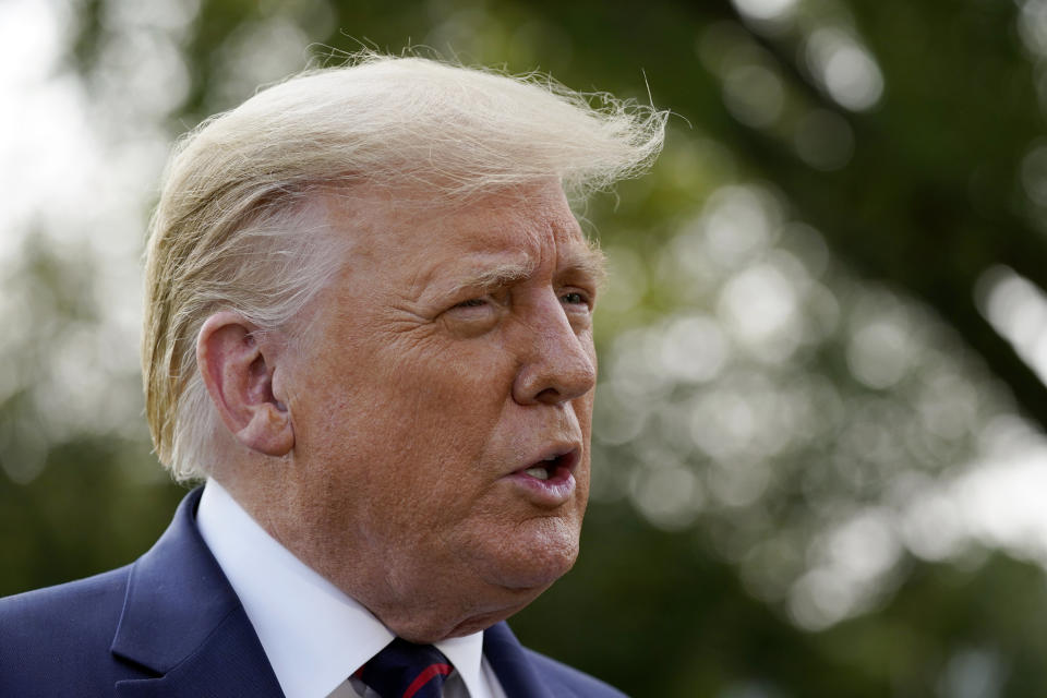 President Donald Trump speaks with reporters as he walks to Marine One on the South Lawn of the White House, Tuesday, Sept. 15, 2020, in Washington. Trump is en route to Philadelphia. (AP Photo/Alex Brandon)