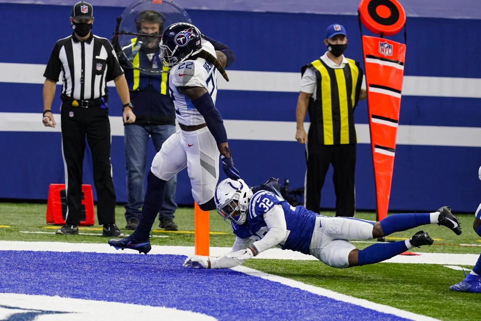 Tennessee Titans running back Derrick Henry (22) gets past Indianapolis Colts free safety Julian Blackmon (32) for a touchdown in the first half of an NFL football game in Indianapolis, Sunday, Nov. 29, 2020. (AP Photo/Darron Cummings)