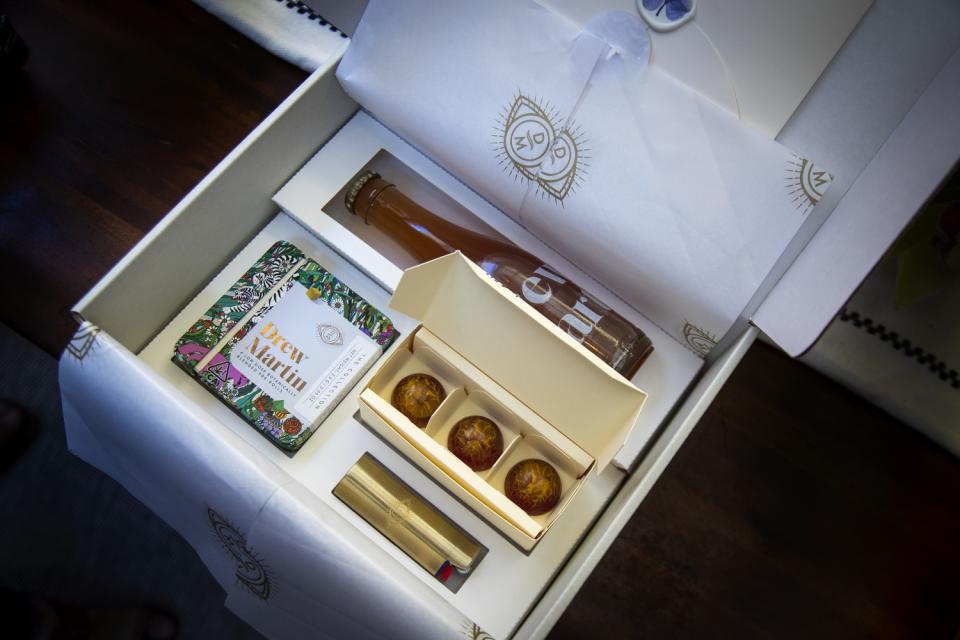 A box from cannabis brand Drew Martin contains a bottle, some chocolate and a pack of pre-rolled joints.