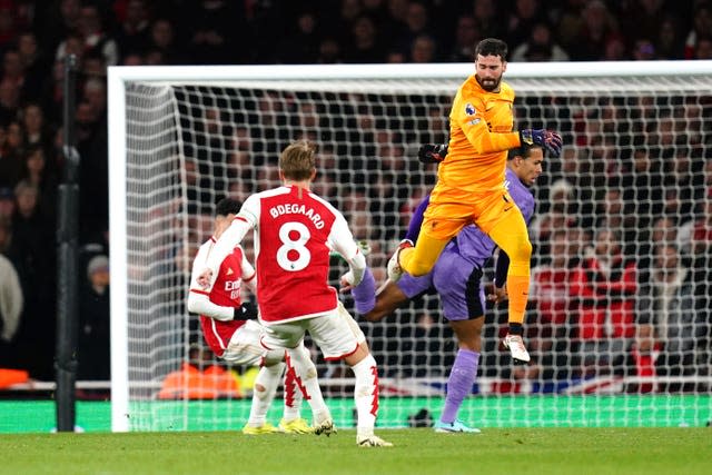 Gabriel Martinelli (left) scores after Alisson Becker and Virgil van Dijk's mix-up