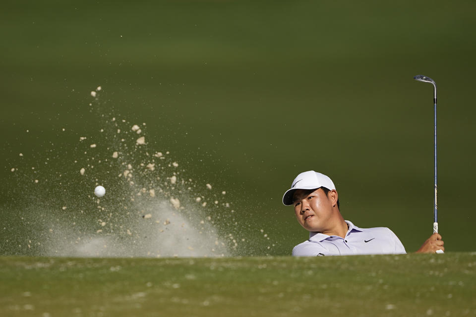 Tom Kim, of South Korea, hits from the bunker on the 15th hole during first round of the Wells Fargo Championship golf tournament at the Quail Hollow Club on Thursday, May 4, 2023, in Charlotte, N.C. (AP Photo/Chris Carlson)