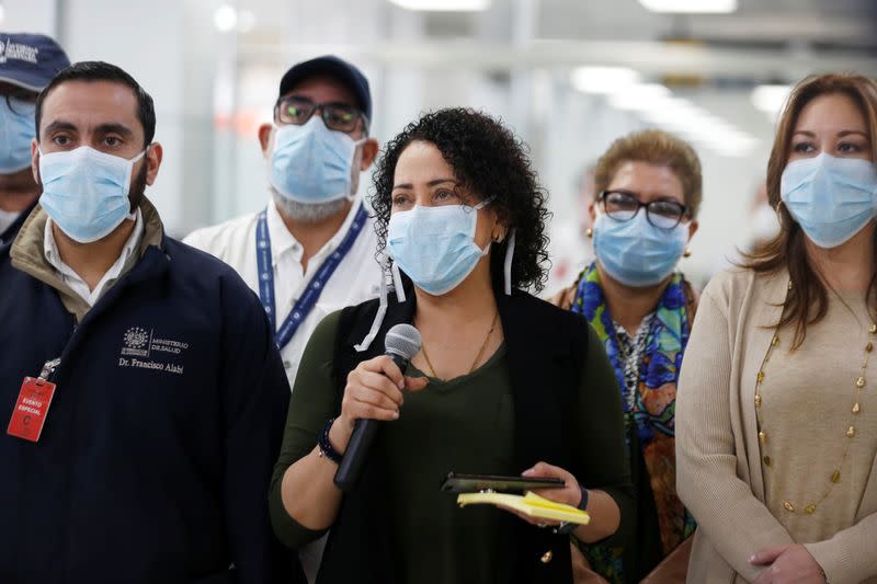 Presidential Commissioner of Government Cabinet Operations, Carolina Recinos speaks wearing a protective face mask during a news conference at the Mons. Oscar Arnulfo Romero International Airport in San Luis Talpa