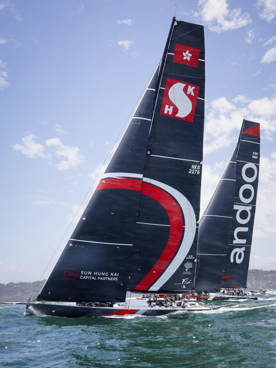 Skallywag, left, and Comanche sail close during the start of the Sydney Hobart yacht race in Sydney, Tuesday, Dec. 26, 2023. The 630-nautical mile race has more than 100 yachts starting in the race to the island state of Tasmania. (Salty Dog/CYCA via AP)