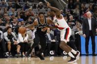 Dec 2, 2018; San Antonio, TX, USA; San Antonio Spurs shooting guard DeMar DeRozan (10) dribbles the ball as Portland Trail Blazers power forward Al-Farouq Aminu (8) defends during the second half at AT&T Center. Mandatory Credit: Soobum Im-USA TODAY Sports