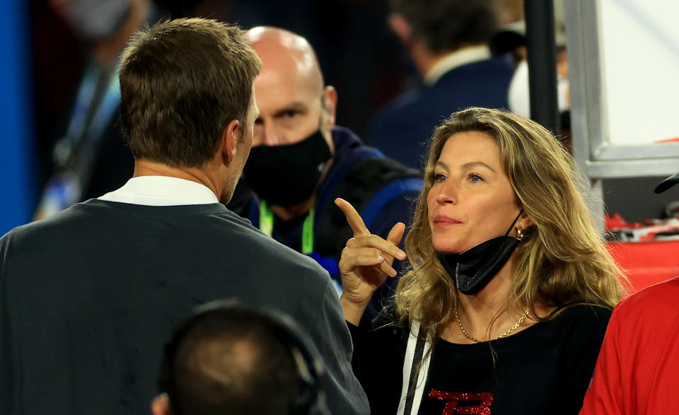 Gisele Bündchen (right) and Tom Brady have reportedly hired divorce lawyers. (Photo by Mike Ehrmann/Getty Images)