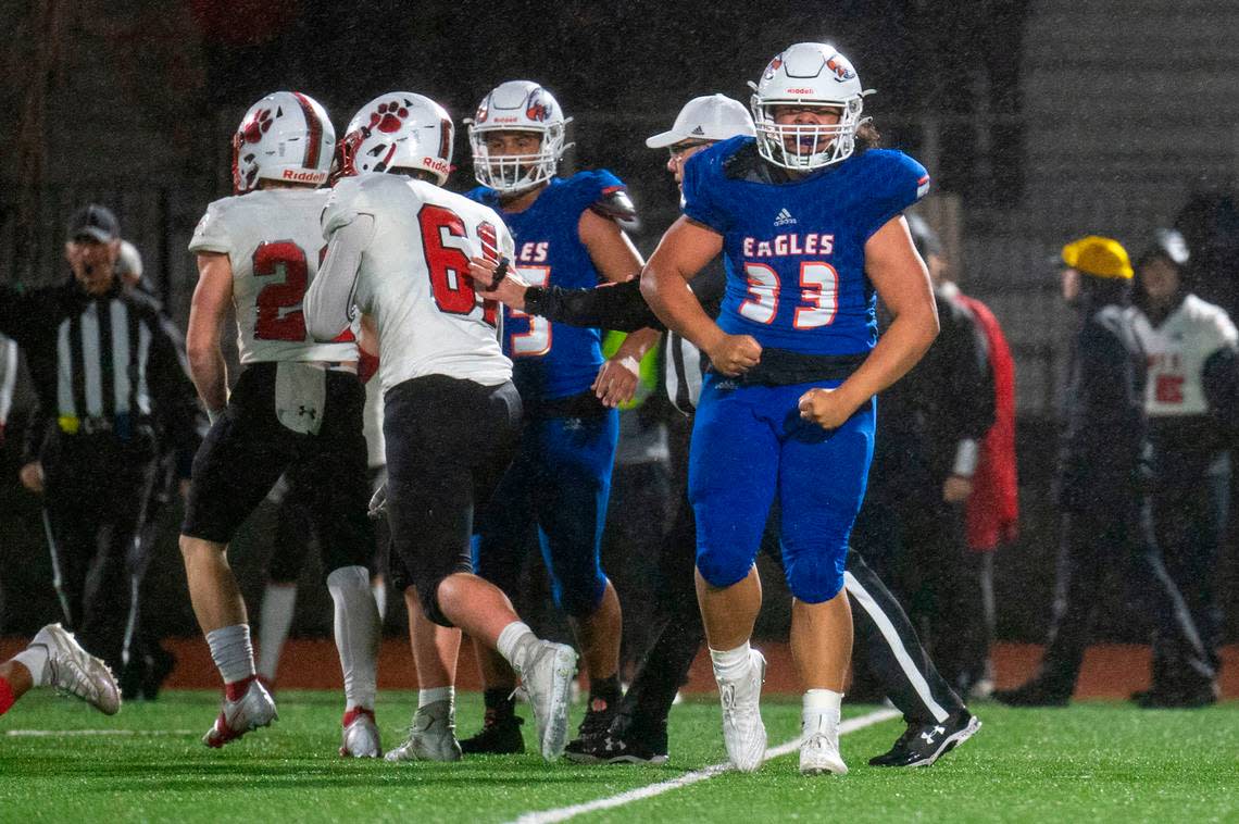Graham-Kapowsin’s Michael Toa celebrates after helping to take down Mount Si running back Jesiah Willis in the backfield during the second quarter of a Week 10 playoff game on Friday, Nov. 4, 2022, at Art Crate Field in Spanaway, Wash.