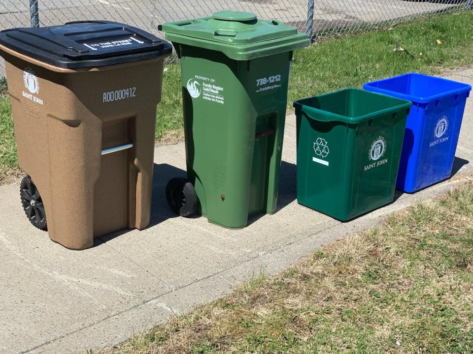 The city will begin delivering the 180L garbage containers (left) and the two 80L recycling containers on September 12.