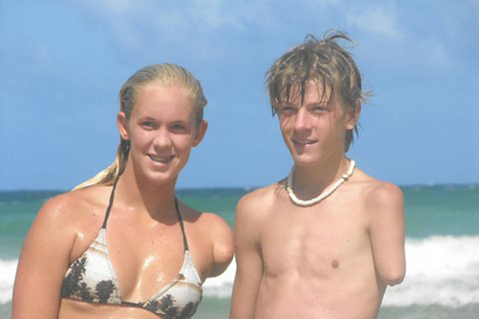 Logan Aldridge, seen here with surfer Bethany Hamilton, learned about adaptive extreme sports somewhat randomly and was able to watch other athletes compete in a modified way. (Courtesy Logan Aldridge)