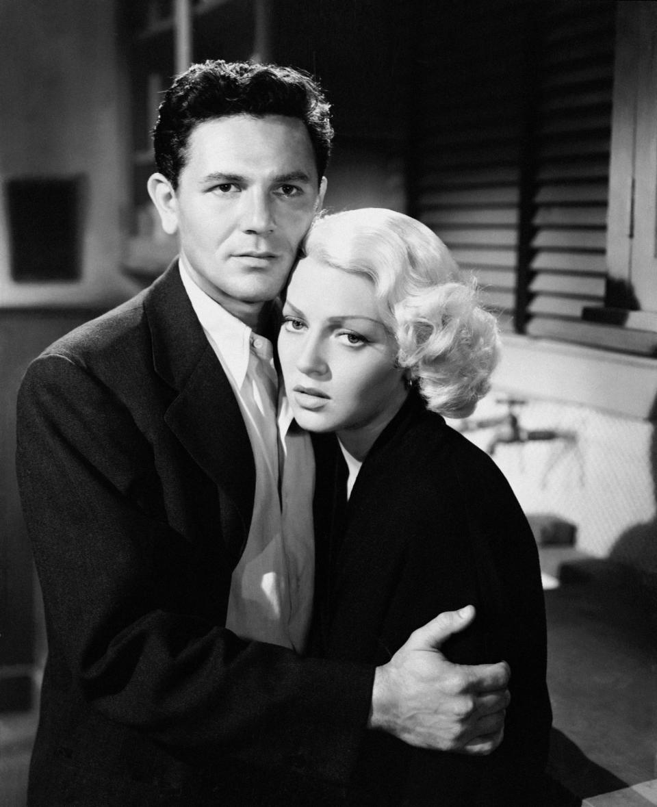 John Garfield clutches Lana Turner in a scene in The Postman Always Rings Twice.