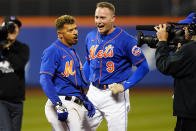 New York Mets' Eduardo Escobar, left, celebrates with teammate Brandon Nimmo after a baseball game against the Miami Marlins Wednesday, Sept. 28, 2022, in New York. The Mets won 5-4. (AP Photo/Frank Franklin II)