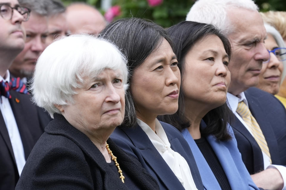 Treasury Secretary Janet Yellen, left, United States Trade Representative Katherine Tai, second from left, and Acting Labor Secretary Julie Su, third from left, listen as President Joe Biden speaks in the Rose Garden of the White House in Washington, Tuesday, May 14, 2024, announcing plans to impose major new tariffs on electric vehicles, semiconductors, solar equipment and medical supplies imported from China. (AP Photo/Susan Walsh)