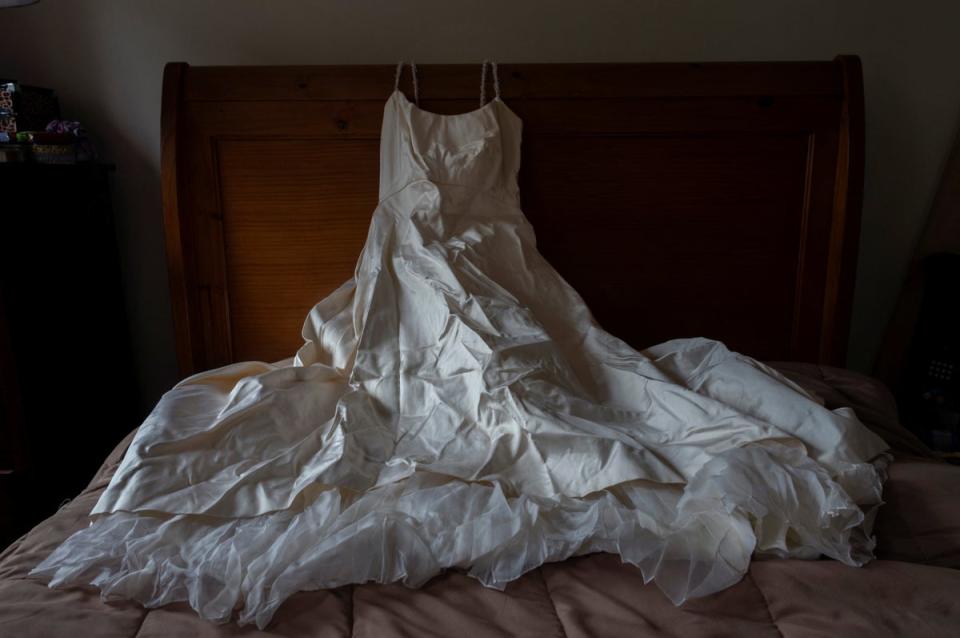 Heather Hurley’s wedding dress lies on a bed at her daughter Nicole Sharpe’s home in Brooklyn (Reuters)