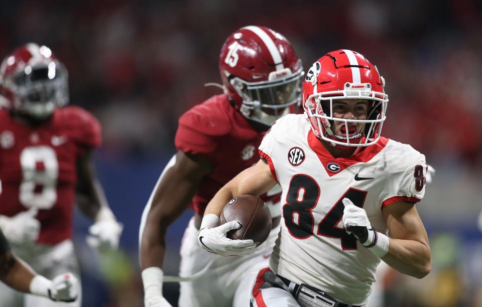 Georgia wide receiver Ladd McConkey (84) runs after a catch for a touchdown against Alabama during the Dec. 4 SEC championship game in Atlanta. Brett Davis-USA TODAY Sports