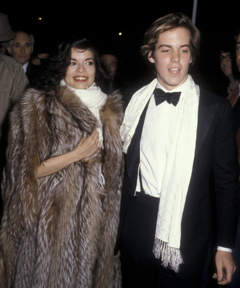 <p>The Nicaraguan actress and activist celebrated the New Year at Woody Allen's 1979 party at Harkness House in New York City. Here, she and date John Samuels, Jr., don matching scarves and she wears an oversize fur coat.</p>