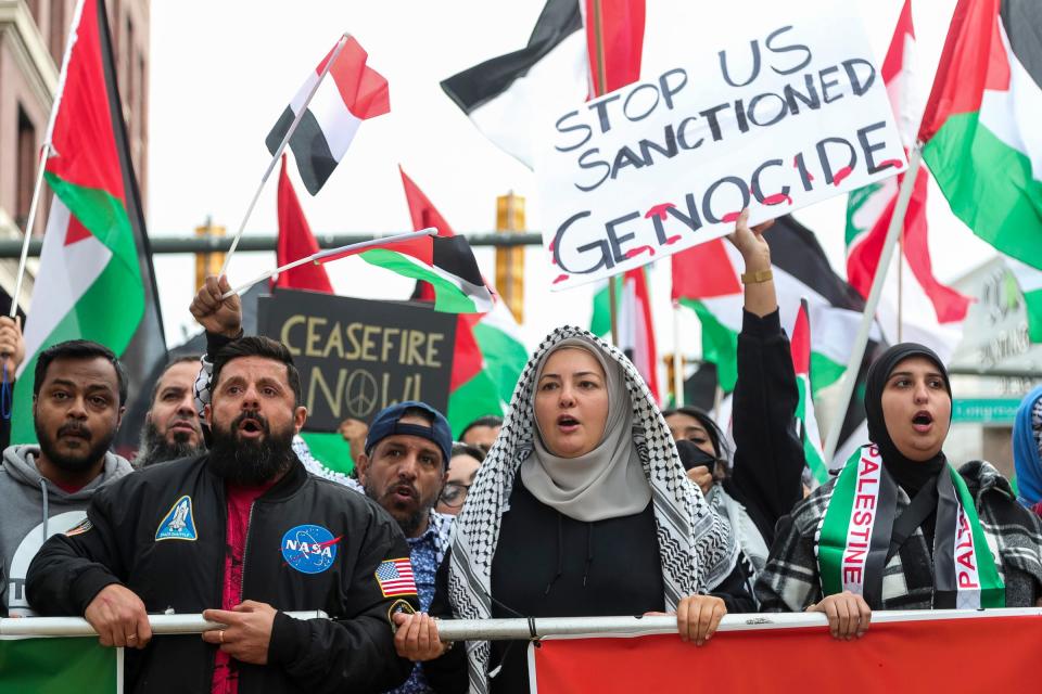 People march to call for cease fire in Gaza in downtown Detroit on Saturday.