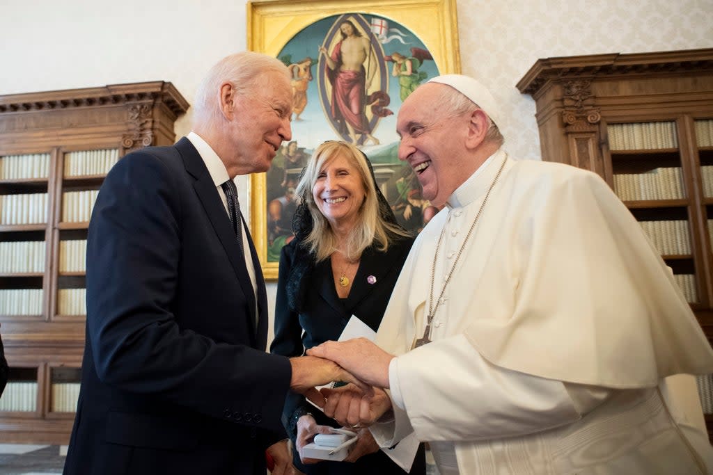 US President Joe Biden, left, shakes hands with Pope Francis as they meet at the Vatican, Friday, Oct. 29, 2021. (Vatican Media via AP)