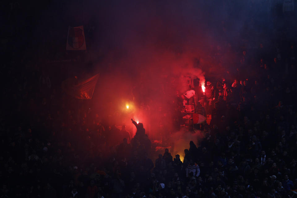 As Roma supporters celebrate during an Italian Cup, semifinal first leg match, between AS Roma and Napoli at Rome's Olympic stadium, Wednesday, Feb. 5, 2014. (AP Photo/Alessandra Tarantino)
