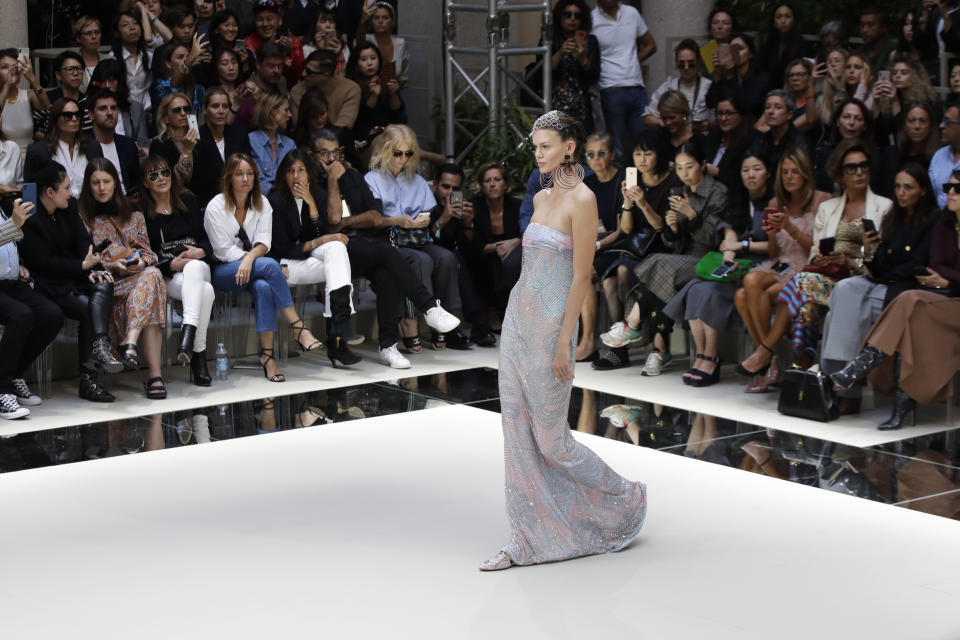 A model wears a creation as part of the Armani Spring-Summer 2020 collection, unveiled during the fashion week, in Milan, Italy, Saturday, Sept. 21, 2019. (AP Photo/Luca Bruno)