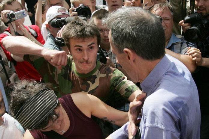A Russian ultra-nationalist punches veteran British gay rights campaigner Peter Tatchell during a denonstration in Moscow (AFP/Getty Images)