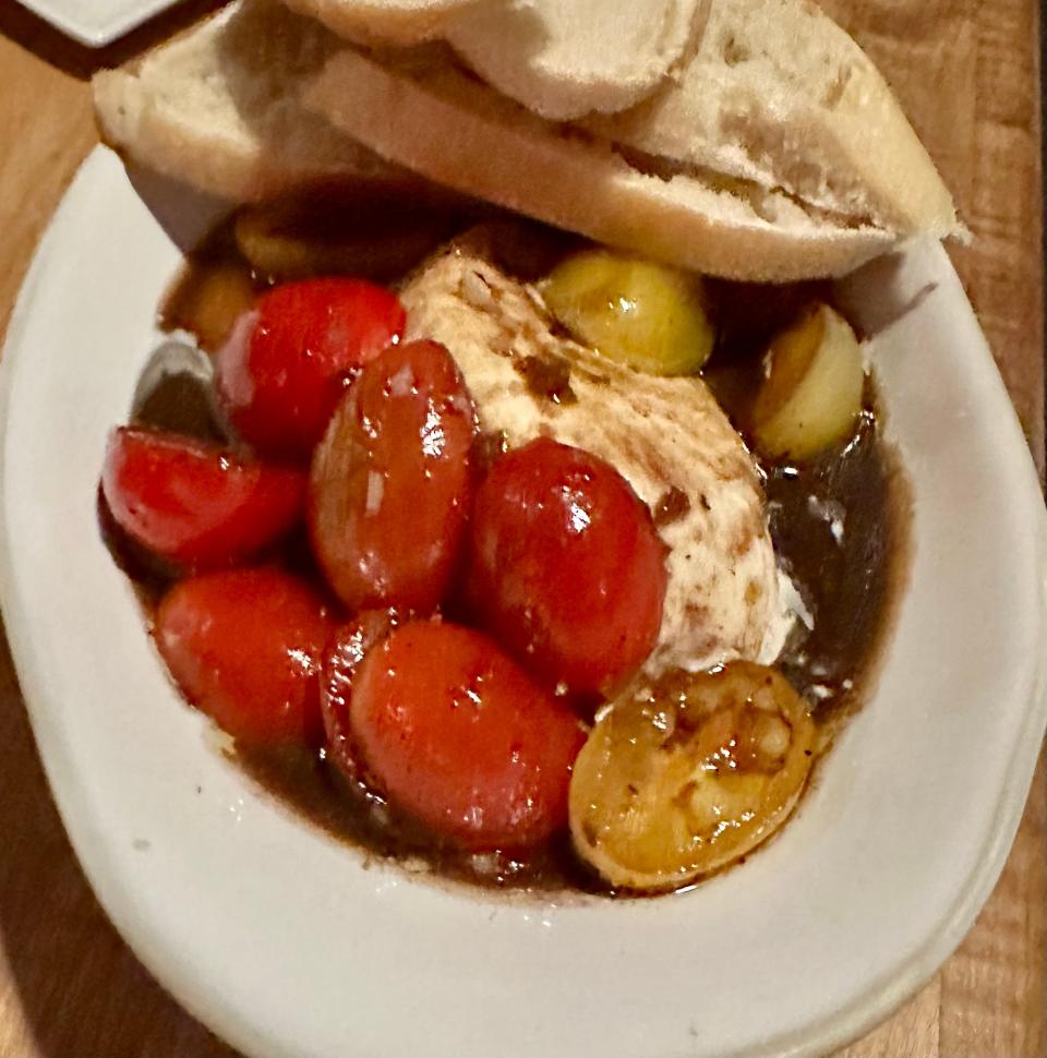 Burrata caprese salad with marinated heirloom tomatoes in a balsamic vinaigrette makes is a seasonal, refreshing, change-of-pace salad at H2 Huth & Harris.