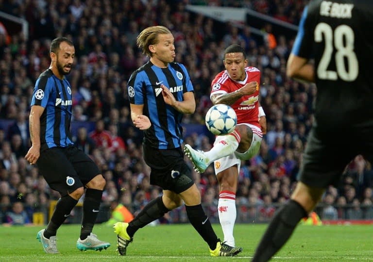 Manchester United's midfielder Memphis Depay (2-R) in action during the UEFA Champions League play off match against Club Brugge at Old Trafford on August 18, 2015