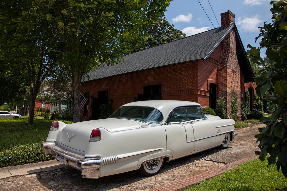 Their classic car, Vinita, is parked in their driveway in downtown Macon.