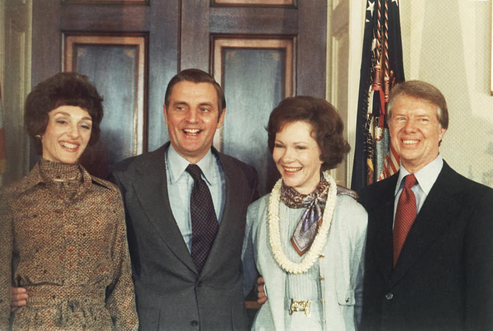 FILE - In this Jan. 21, 1977, file photo, President Jimmy Carter, right, and Rosalynn Carter, second from right, pose with Vice President Walter Mondale and wife, Joan Mondale, left, following Carter's inauguration in the White House Blue Room in Washington. Mondale, a liberal icon who lost the most lopsided presidential election after bluntly telling voters to expect a tax increase if he won, died Monday, April 19, 2021. He was 93. (AP Photo/Peter Bregg, File)