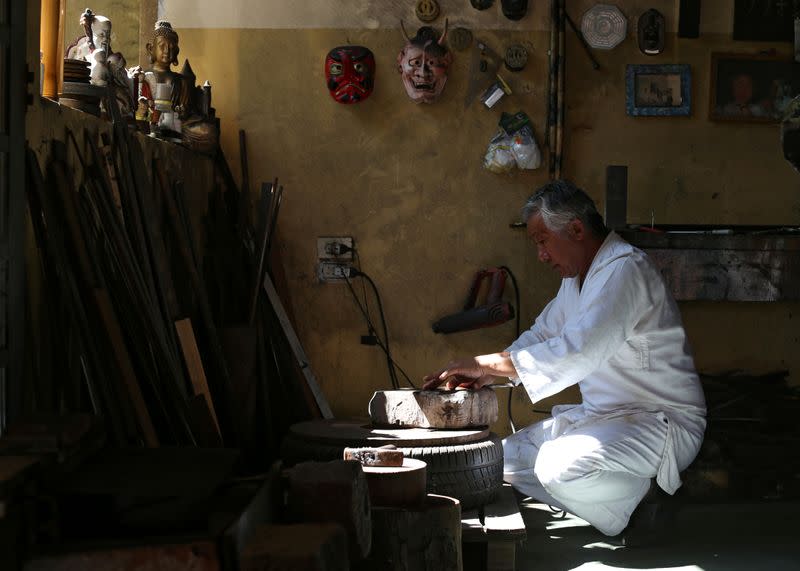 Samurai Suemitsu prepares a katana sword at his home in Curitiba