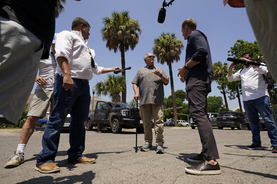 Uvalde Mayor Don McLaughlin, Jr., center, speaks to media following a special emergency city council meeting to reissue the mayor's declaration of local state of disaster due to the recent school shooting at Robb Elementary School, Tuesday, June 7, 2022, in Uvalde, Texas. (AP Photo/Eric Gay)