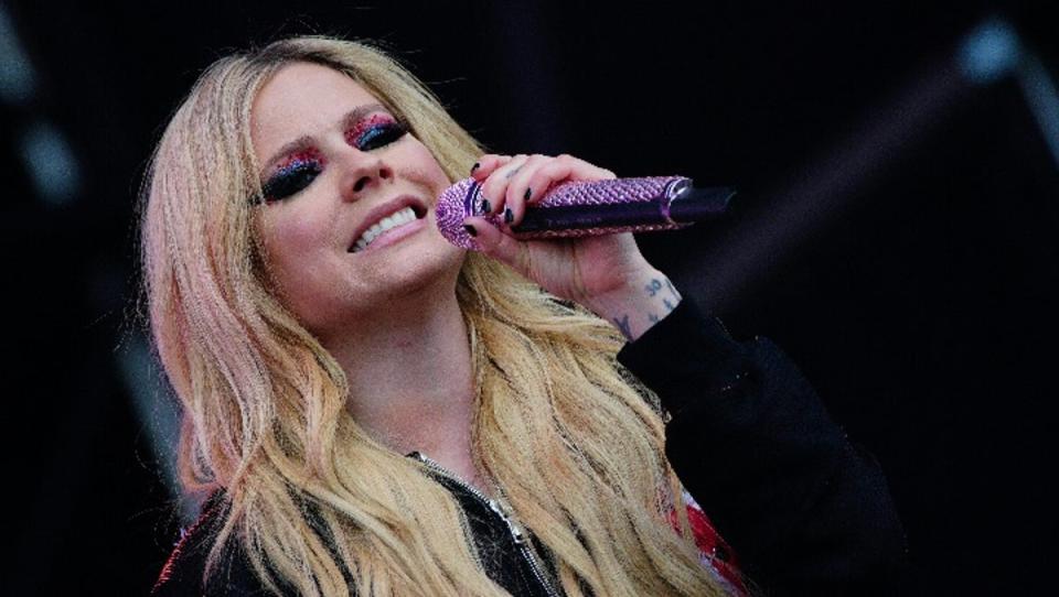 Lavigne performing to a large crowd at the Other Stage (PA)