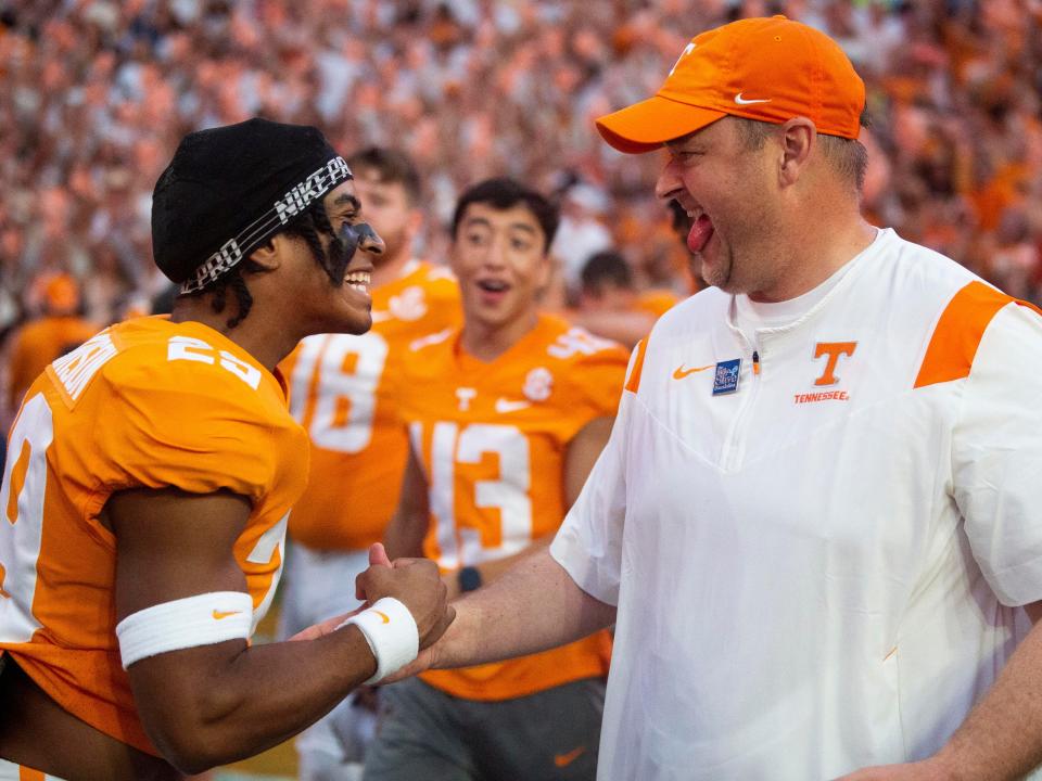 Tennessee defensive back Christian Harrison (29) and head coach Josh Heupel celebrate after the win over Florida during an NCAA college football on Saturday, September 24, 2022 in Knoxville, Tenn. 