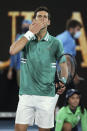 Serbia's Novak Djokovic celebrates after defeating France's Jeremy Chardy during their first round match at the Australian Open tennis championship in Melbourne, Australia, Monday, Feb. 8, 2021. (AP Photo/Hamish Blair)