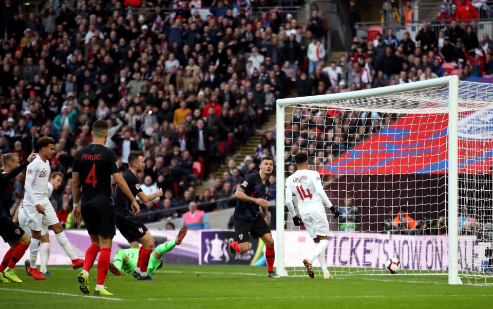 England’s Jesse Lingard levels from close range, tapping home Harry Kane’s effort