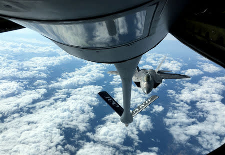 One of two U.S. Air Force F-22 stealth fighter jets receives fuel mid-air from a KC-135 refueling plane over Norway en route to a joint training exercise with Norway's growing fleet of F-35 jets August 15, 2018. REUTERS/Andrea Shalal
