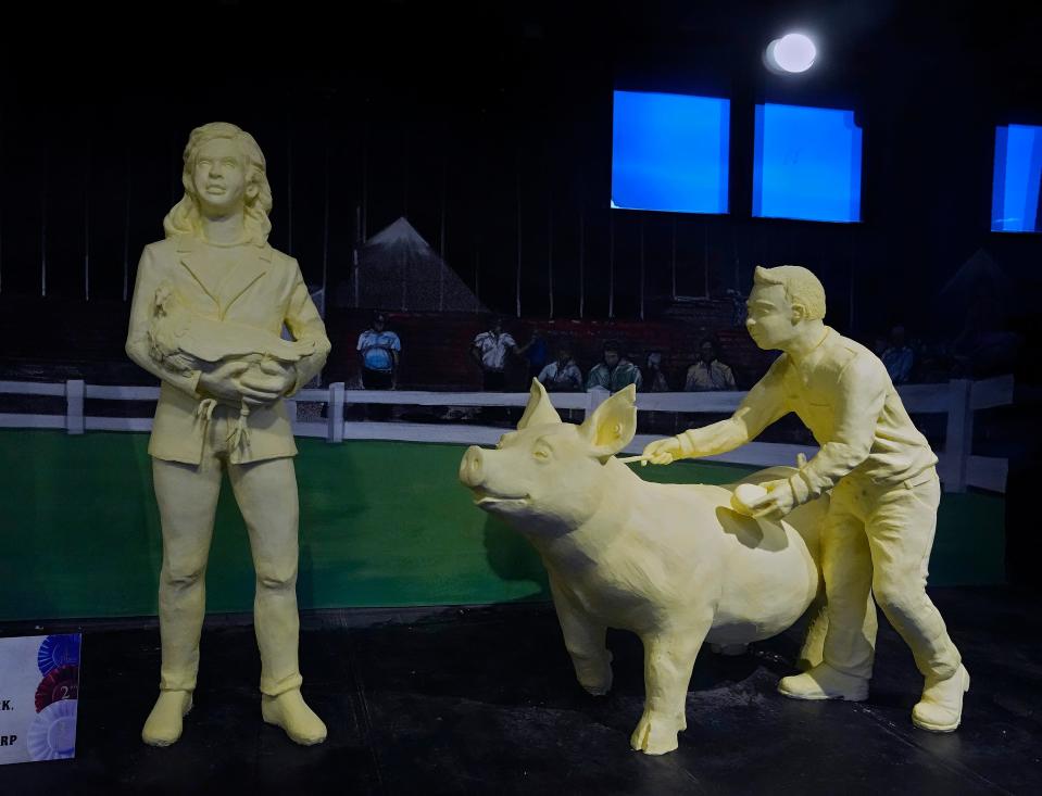 This year's butter sculptures are intended to highlight the agricultural roots of the state fair, which opens Wednesday and runs through Aug. 7.