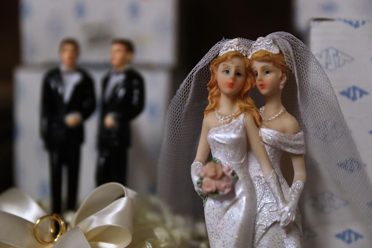 Same-sex marriage cake toppers are displayed on a shelf at Fantastico on December 5, 2017 in San Francisco, California.