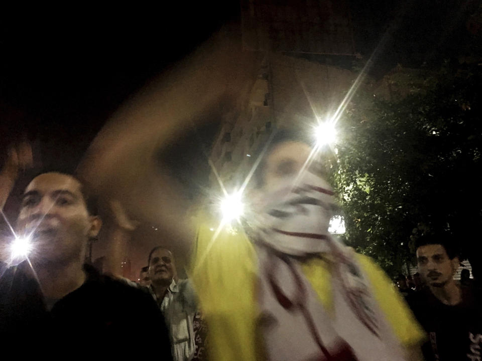 Protesters chant slogans against the regime in Cairo, Egypt, early Saturday, Sept. 21, 2019. Dozens of people held a rare protest in Cairo during which they called on Egyptian President Abdel-Fattah el-Sissi to quit. Security forces dispersed the protesters and no casualties were reported. (AP Photo/Nariman El-Mofty)