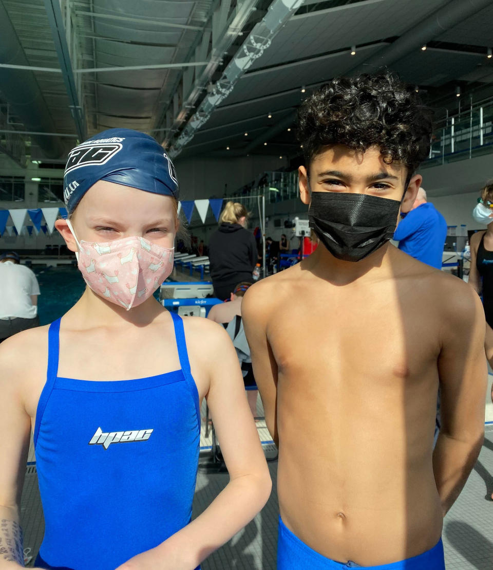 Amy Kiefer's 7-year-old daughter and Kiefer's best friend's older son, posing before a swim meet during happier times. (Courtesy Amy Kiefer)