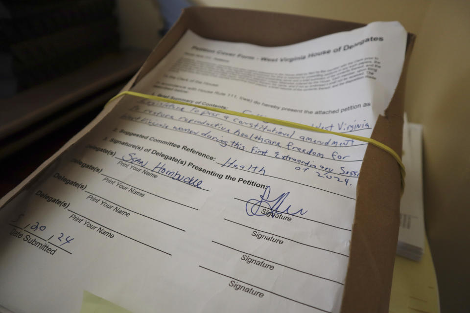 A petition to put abortion access on the ballot in West Virginia sits on a table in the empty House of Delegates Health and Human Resources Committee office on June 21, 2024 at the State Capitol in Charleston, W.Va. Submitted by the minority Democrats during a special session of the state Legislature in May, the petition was sent to the Health and Human Resources Committee for consideration. Republican leadership declined to take the matter up. (AP Photo/Leah Willingham)