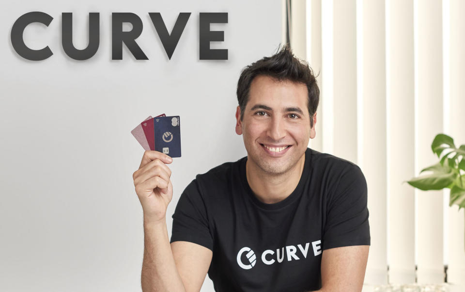 Curve CEO and founder Shachar Bialick with his company's cards. Photo: Curve