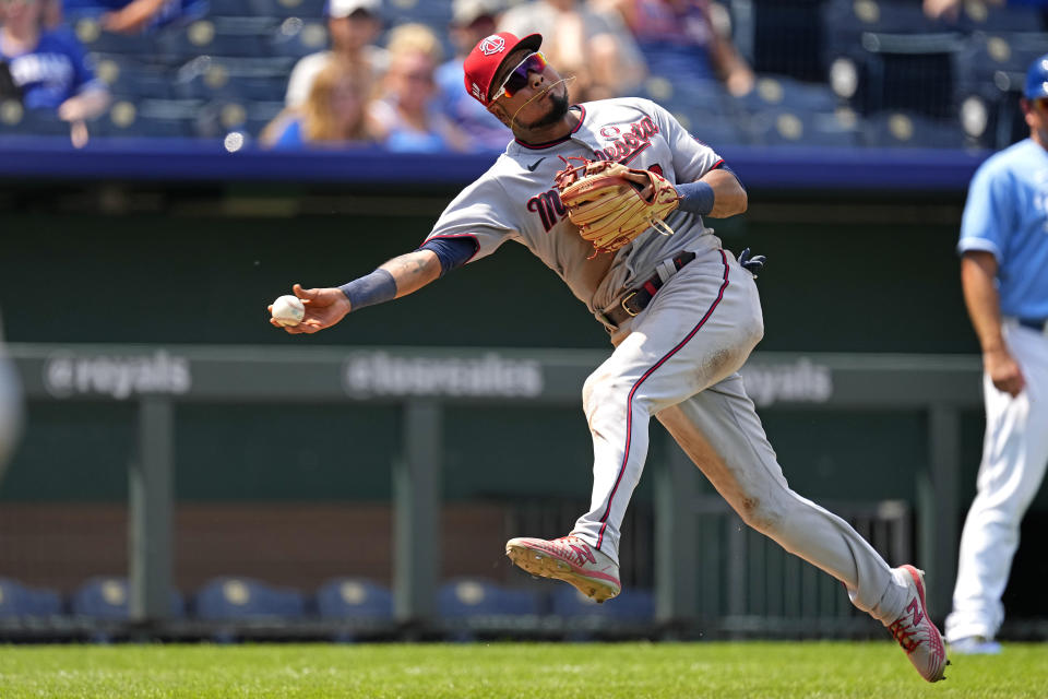 Minnesota Twins third baseman Luis Arraez throws to first after fielding a single by Kansas City Royals' Hunter Dozier during the seventh inning of a baseball game Sunday, July 4, 2021, in Kansas City, Mo. (AP Photo/Charlie Riedel)