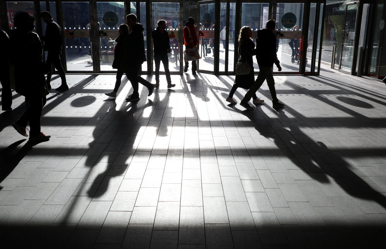 People's shadows are seen as shoppers are silhouetted in the bright sunshine at the Westfield shopping centre, Stratford, London January, 28, 2017.     REUTERS/Russell Boyce
