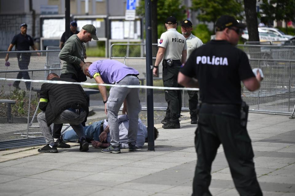 Police arrest a man after Slovak Prime Minister Robert Fico was shot and injured (AP)