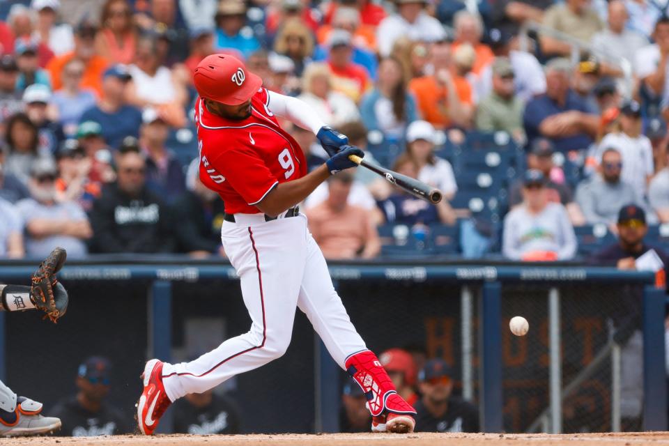 Washington Nationals third baseman Jeimer Candelario (9) hits a single during the first inning against the Detroit Tigers at The Ballpark of the Palm Beaches in West Palm Beach, Florida, on March 19, 2023.